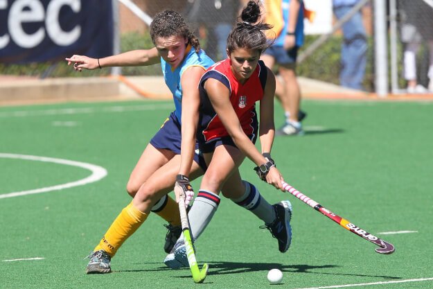 Patrick Case, pexels Two female athletes playing field hockey